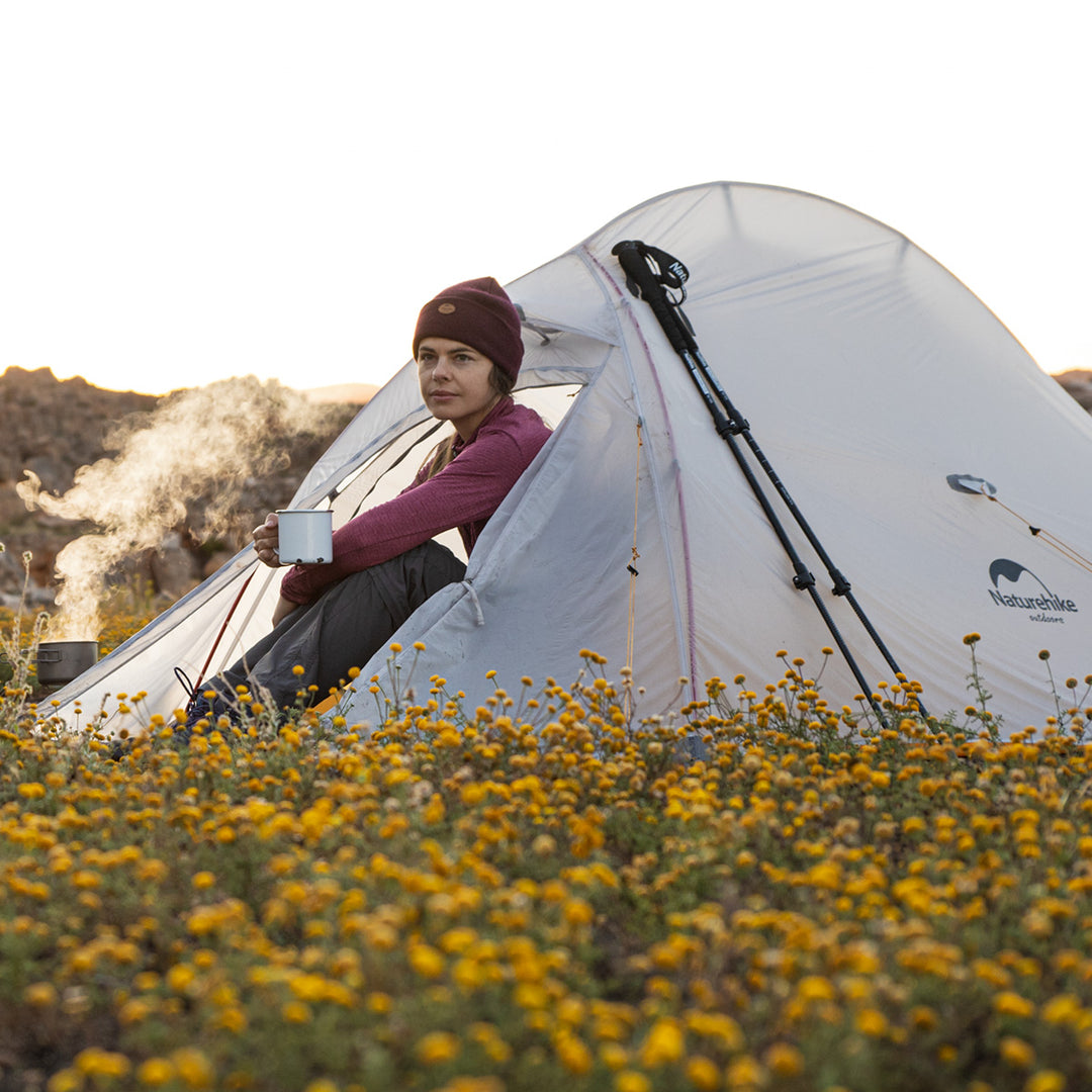 woman sitting in naturehike cloud wing tent in outdoor
