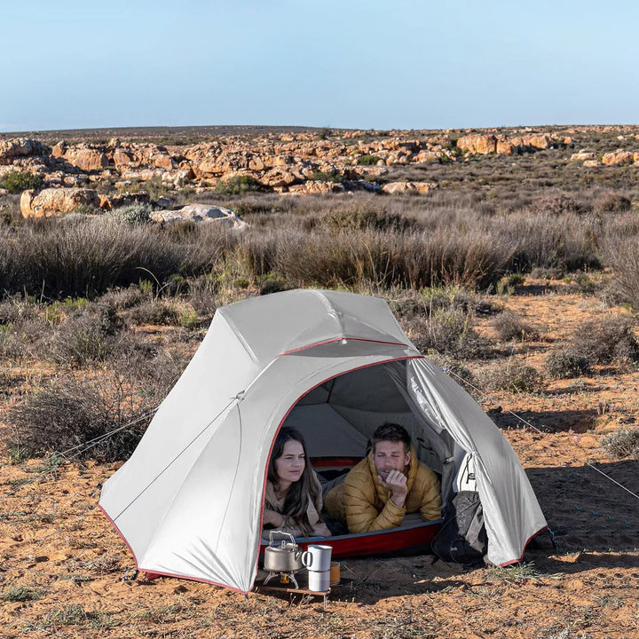 man and woman lying inside cloud up 3 person tent